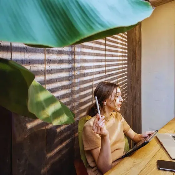 Woman video conferencing with laptop in office