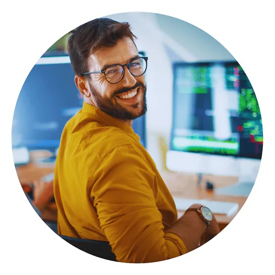 Smiling developer at computer workstation