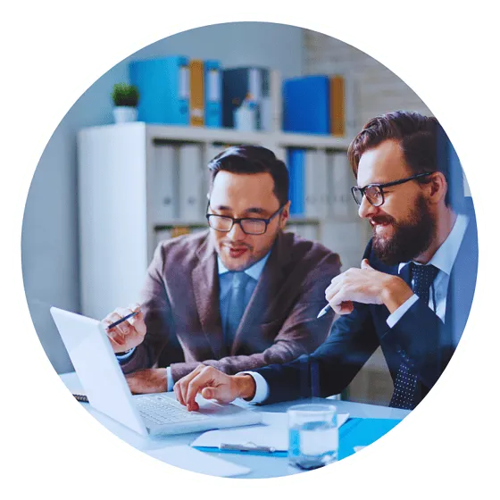 Two businessmen discussing work on a laptop