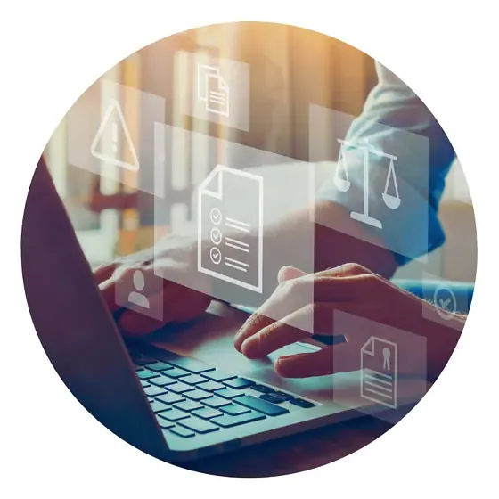 Person typing on laptop with digital icons overlay.