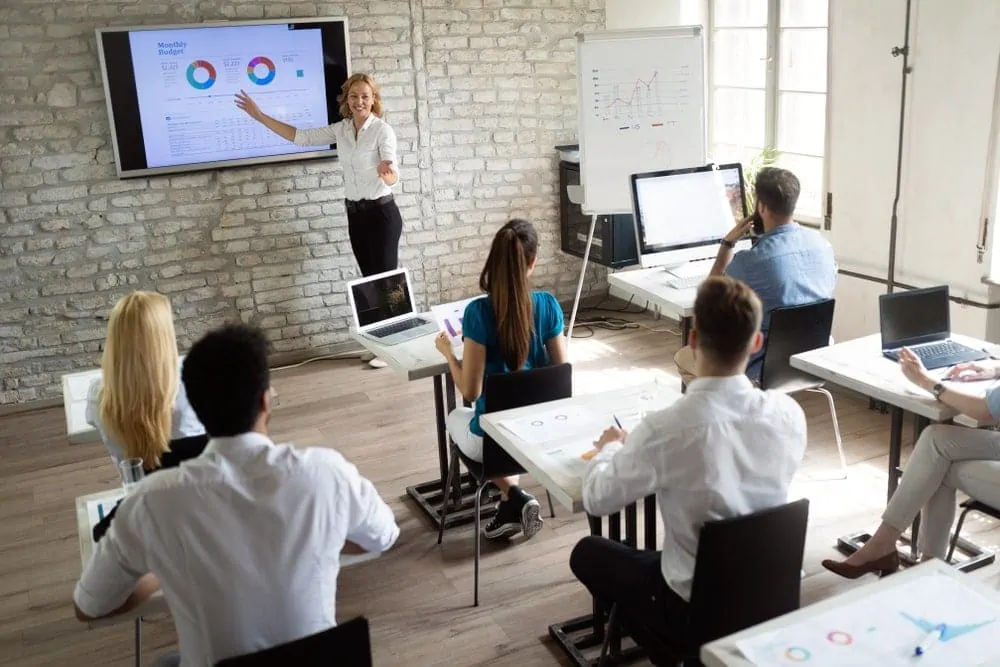 Business presentation in modern classroom setting.