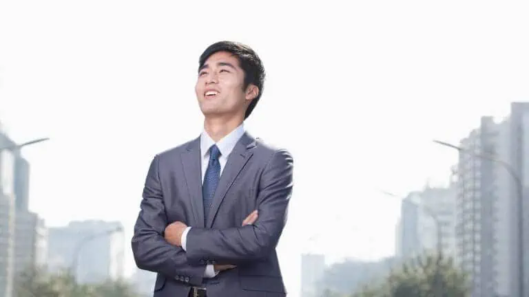 Confident businessman smiling in urban setting