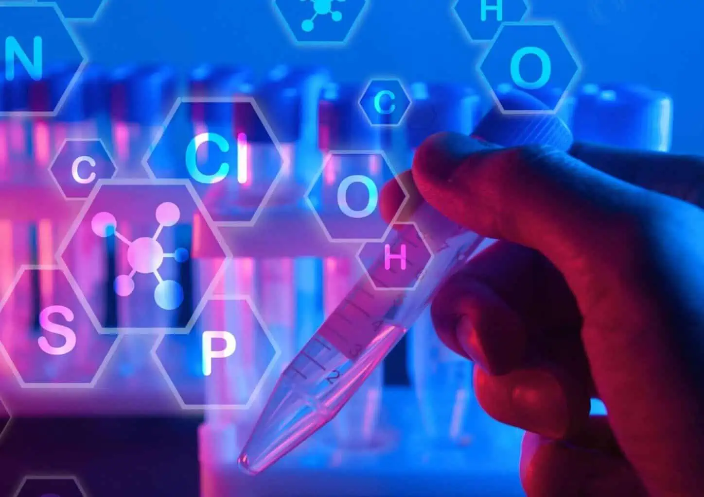 Hand holds test tube with chemical formulas overlay.