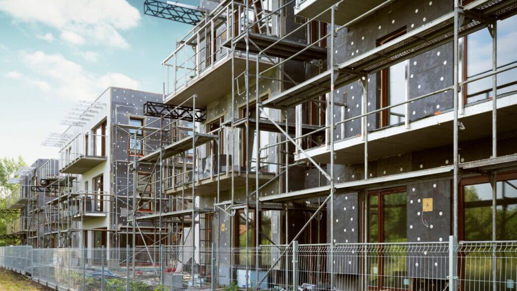 Modern building under construction with scaffolding.