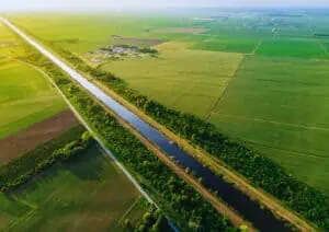 Aerial view of farmland with canal.