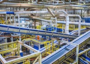 Industrial facility with machinery and conveyor belts.