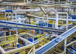 Industrial facility with machinery and conveyor belts.