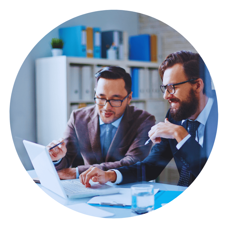 Two businessmen discussing work on a laptop